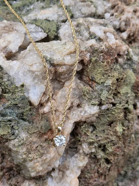 This Beautiful .25 ct Diamond is set in 14k gold.